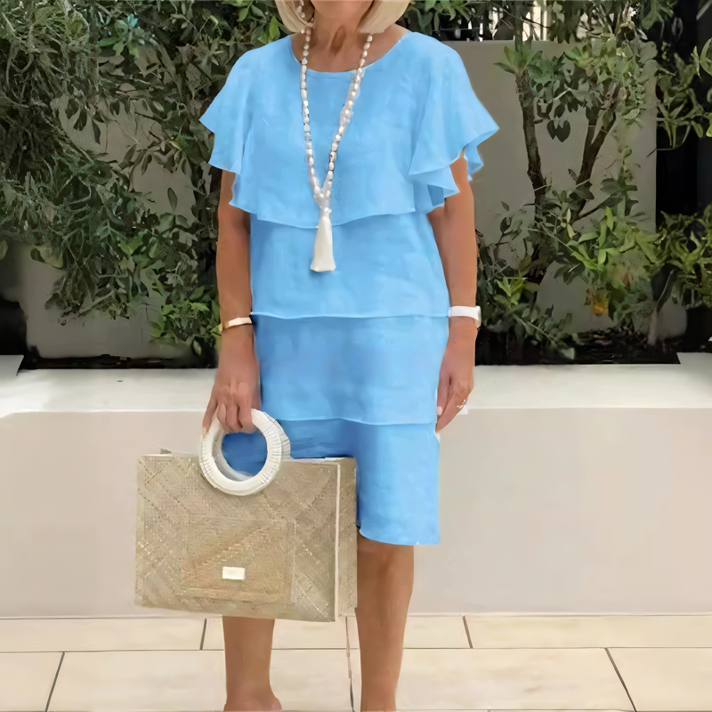 Justine | Knee-length chiffon dress with short sleeves and ruffles