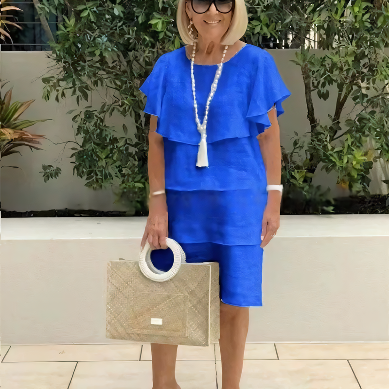 Justine | Knee-length chiffon dress with short sleeves and ruffles