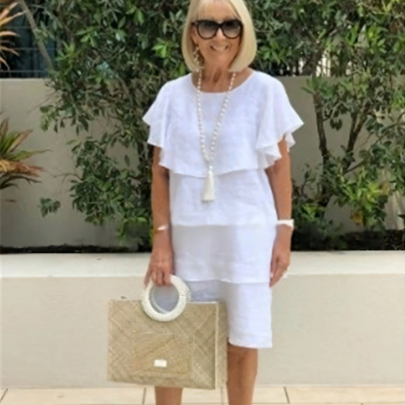 Justine | Knee-length chiffon dress with short sleeves and ruffles